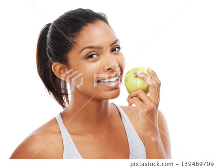 Happy woman, apple and eating of healthy food for nutrition, detox and wellness in a studio portrait. Young african person with green fruit for healthcare, lunch or vegan choice on a white background Happy woman, apple and eating of healthy food for nutrition, detox and wellness in a studio portrait. Young african person with green fruit for healthcare, lunch or vegan choice on a white background 139469709