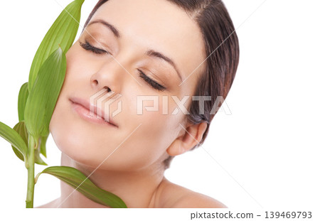 Leaf, skincare and woman in studio for makeup, wellness and eco friendly cosmetics on white background. Plant, beauty and face of female model with natural dermatology, treatment or skin detox shine Leaf, skincare and woman in studio for makeup, wellness and eco friendly cosmetics on white background. Plant, beauty and face of female model with natural dermatology, treatment or skin detox shine 139469793