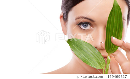 Woman, skincare and beauty with leaves in studio portrait, mockup space and growth by white background. Girl, model or person with sustainability, wellness and natural dermatology for facial change Woman, skincare and beauty with leaves in studio portrait, mockup space and growth by white background. Girl, model or person with sustainability, wellness and natural dermatology for facial change 139469817