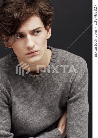 Thinking, fashion and man in sweater in studio isolated on a a black background. Serious model in jersey, idea and dream in style, trendy clothes and young, handsome or casual person on a backdrop Thinking, fashion and man in sweater in studio isolated on a a black background. Serious model in jersey, idea and dream in style, trendy clothes and young, handsome or casual person on a backdrop 139469827