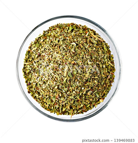 Dried oregano and basil seasoning blend in bowl 139469883