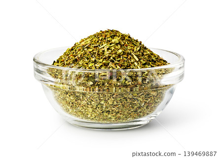 Dried oregano spices filling a glass bowl for cooking Dried oregano spices filling a glass bowl for cooking 139469887