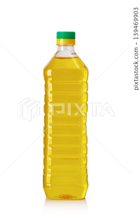Plastic bottle containing yellow cooking oil on white Plastic bottle containing yellow cooking oil on white 139469903