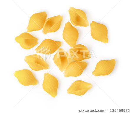 Dry conchiglie pasta shells arranging on white surface Dry conchiglie pasta shells arranging on white surface 139469975