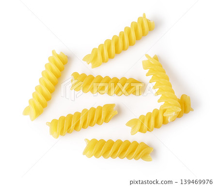 Uncooked fusilli pasta spirals on white background 139469976