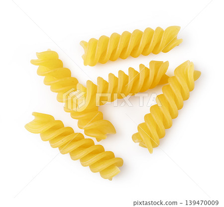 Dry fusilli pasta spirals on white background 139470009