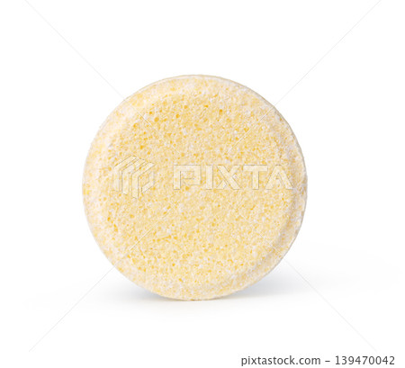 Effervescent yellow tablet standing upright Effervescent yellow tablet standing upright 139470042