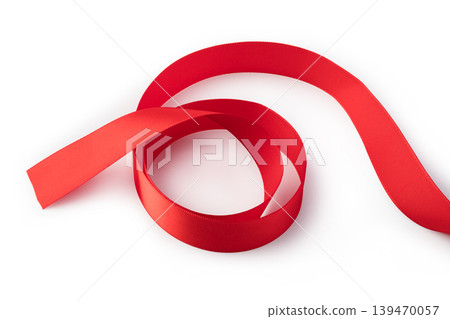 Red satin ribbon forming decorative swirling pattern Red satin ribbon forming decorative swirling pattern 139470057