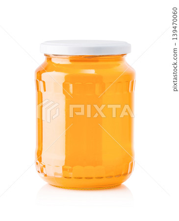 Glass jar filled with natural organic honey Glass jar filled with natural organic honey 139470060