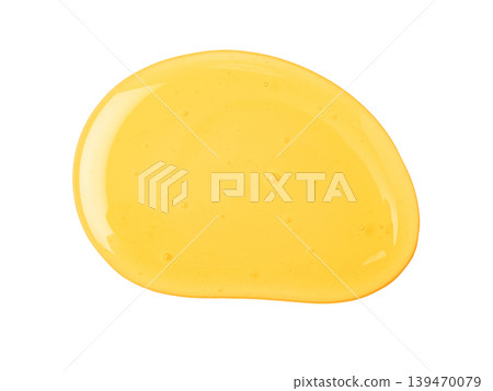 Golden honey puddle dripping liquid isolated on white Golden honey puddle dripping liquid isolated on white 139470079