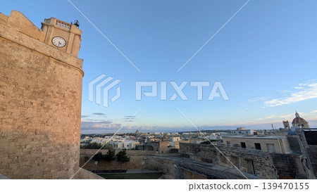 Cityscape seen from a hilltop fortress in the evening in Gozo 139470155