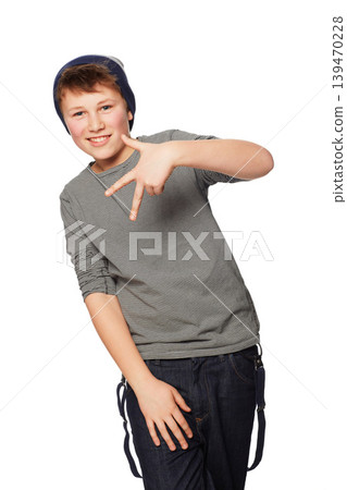 Portrait, fashion and hand gesture with a boy child in studio isolated on a white background for style. Smile, hip or trendy with a happy young kid looking confident or cool in a clothes outfit Portrait, fashion and hand gesture with a boy child in studio isolated on a white background for style. Smile, hip or trendy with a happy young kid looking confident or cool in a clothes outfit 139470228