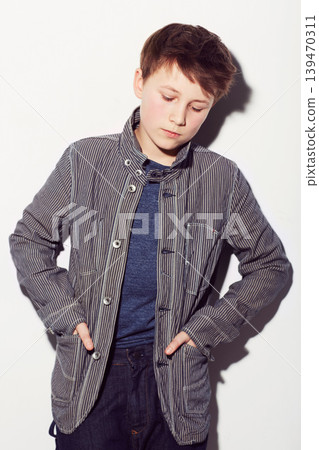 Sad, teenager and insecure boy in studio, white background or thinking about fashion. Child, anxiety and worry for style, clothes and struggle with emotions, thoughts and personality in backdrop Sad, teenager and insecure boy in studio, white background or thinking about fashion. Child, anxiety and worry for style, clothes and struggle with emotions, thoughts and personality in backdrop 139470311