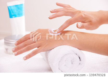 Skincare, cream and hands closeup in spa, touch and massage on towel. Fingers, nails and woman apply lotion in treatment, natural cosmetics and dermatology moisturizer, beauty health and manicure Skincare, cream and hands closeup in spa, touch and massage on towel. Fingers, nails and woman apply lotion in treatment, natural cosmetics and dermatology moisturizer, beauty health and manicure 139470328