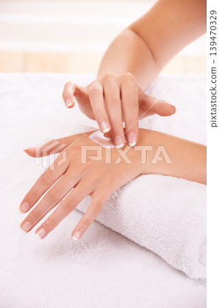 Skin, apply cream and hands in spa, closeup and massage on towel for care. Touch fingers, nails and woman on lotion treatment, natural cosmetics or dermatology moisturizer, beauty health or manicure Skin, apply cream and hands in spa, closeup and massage on towel for care. Touch fingers, nails and woman on lotion treatment, natural cosmetics or dermatology moisturizer, beauty health or manicure 139470329