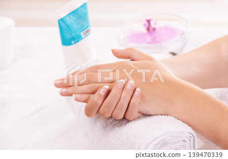 Woman, hands and french manicure in spa, salon and cosmetic care, skincare and beauty. Tips, wellness and treatment for hygiene, closeup and nail parlour with towel, clean and healthy cuticles Woman, hands and french manicure in spa, salon and cosmetic care, skincare and beauty. Tips, wellness and treatment for hygiene, closeup and nail parlour with towel, clean and healthy cuticles 139470339