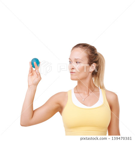 Woman, squeeze and stress ball in fitness for exercise against a white studio background. Serious female person in relief, tension or anger management in gym workout or training on mockup space Woman, squeeze and stress ball in fitness for exercise against a white studio background. Serious female person in relief, tension or anger management in gym workout or training on mockup space 139470381