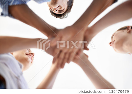 Low angle, huddle and solidarity by colleagues, hands and collaboration or support, unity and staff. People, meeting and brainstorming together, trust and planning or agreement in team building 139470479