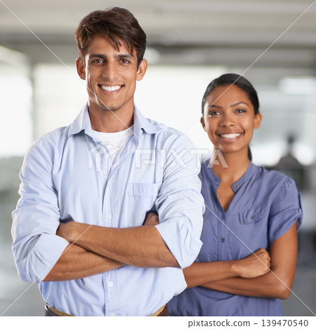 Business, portrait and arms crossed in team in workplace, corporate career and positive in about us. Man, woman and face as diversity in start up, trust and collaboration as professional in office Business, portrait and arms crossed in team in workplace, corporate career and positive in about us. Man, woman and face as diversity in start up, trust and collaboration as professional in office 139470540