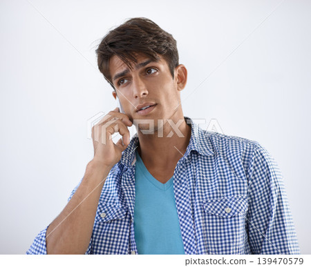 Phone call, discussion and studio man listening, consulting and networking conversation with mobile cellphone user. Smartphone, communication and person speaking with contact on white background Phone call, discussion and studio man listening, consulting and networking conversation with mobile cellphone user. Smartphone, communication and person speaking with contact on white background 139470579