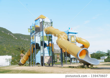 The slide at Mammoth Play Park TARUMI (Kamezu Central Park), viewed from an angle. The slide at Mammoth Play Park TARUMI (Kamezu Central Park), viewed from an angle. 139470607