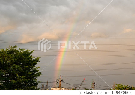 A landscape with a rainbow at dusk 139470662