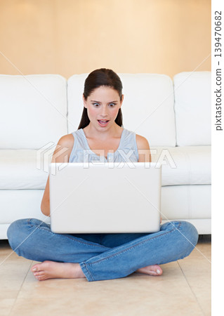 Surprise, woman and sitting with laptop on floor for good news or social media in living room at home. Shocked female person or freelancer on computer for notification, deal or alert by sofa at house Surprise, woman and sitting with laptop on floor for good news or social media in living room at home. Shocked female person or freelancer on computer for notification, deal or alert by sofa at house 139470682