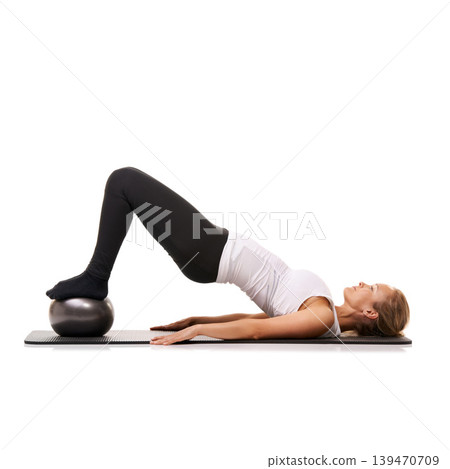 Workout, stretching and woman on floor with ball for pilates, body fitness care and health in studio. Gym, training and girl on mat with cardio, energy or muscle exercise isolated on white background Workout, stretching and woman on floor with ball for pilates, body fitness care and health in studio. Gym, training and girl on mat with cardio, energy or muscle exercise isolated on white background 139470709