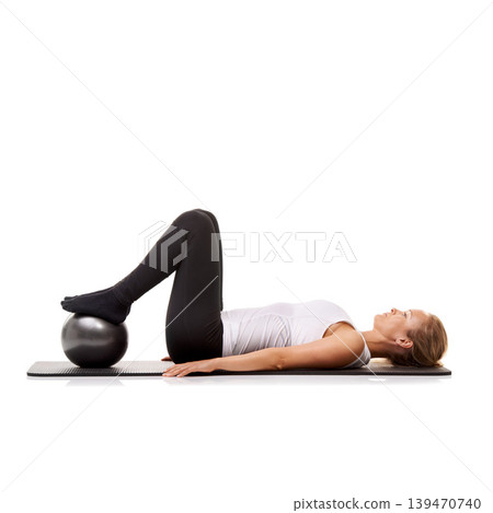 Yoga, exercise and woman on floor with ball for pilates, wellness care and health in studio. Gym, training and girl on mat with workout, lying and muscle fitness isolated on white background. Yoga, exercise and woman on floor with ball for pilates, wellness care and health in studio. Gym, training and girl on mat with workout, lying and muscle fitness isolated on white background. 139470740