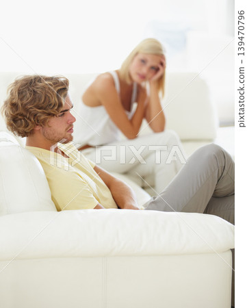 Angry couple, stress and divorce fight on a sofa with argument, anxiety or cheating depression in their home. Marriage crisis, dispute and overthinking man ignore toxic woman liar in a living room Angry couple, stress and divorce fight on a sofa with argument, anxiety or cheating depression in their home. Marriage crisis, dispute and overthinking man ignore toxic woman liar in a living room 139470796