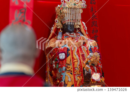 Man Gazes at Guandu Mazu Deity Statue Red Shrine Background Neihu Taipei Man Gazes at Guandu Mazu Deity Statue Red Shrine Background Neihu Taipei 139471026
