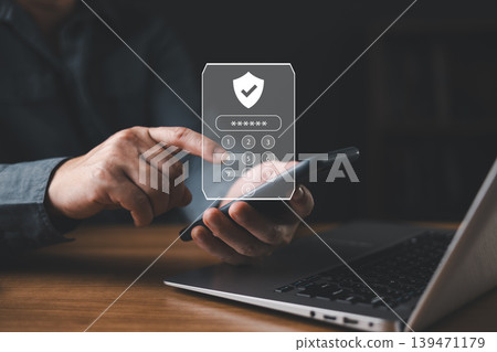 Man entering password on smartphone with digital security interface, symbolizing cybersecurity, data protection, two factor authentication, and secure online access for privacy and technology concept. Man entering password on smartphone with digital security interface, symbolizing cybersecurity, data protection, two factor authentication, and secure online access for privacy and technology concept. 139471179
