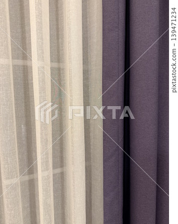 Curtains with sheer and solid fabrics in neutral and purple tones create a versatile background Curtains with sheer and solid fabrics in neutral and purple tones create a versatile background 139471234