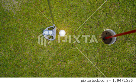 Golfers are putting golf in the evening golf course golf backglound. 139471556