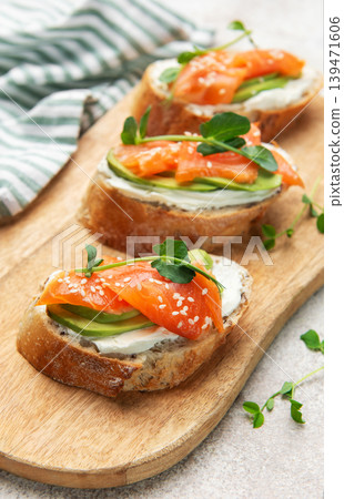 Smoked salmon toast with avocado and cream cheese Smoked salmon toast with avocado and cream cheese 139471606