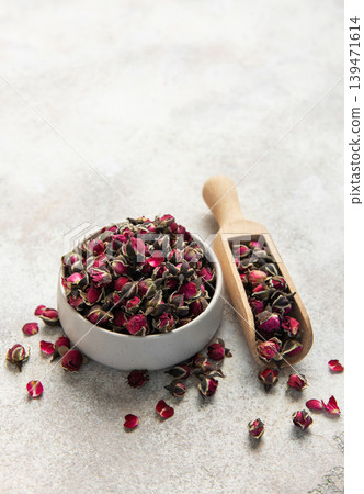 Dried rose buds with wooden scoop for herbal tea Dried rose buds with wooden scoop for herbal tea 139471614