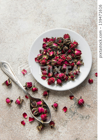 Dried rose buds creating floral herbal tea mix Dried rose buds creating floral herbal tea mix 139471616