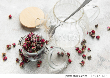 Glass teapot with dried rose buds for herbal tea Glass teapot with dried rose buds for herbal tea 139471618