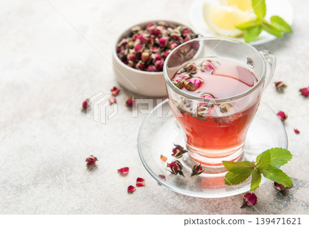 Pink rose herbal tea with dried buds and mint Pink rose herbal tea with dried buds and mint 139471621