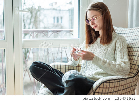 Woman opening a cardboard box 139471655