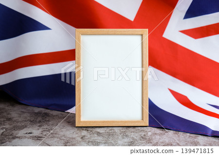 Empty white paper frame National symbol of Great Britain. Mock up advertisement template British wave UK fabric flag background. Copy space for your text. Independence Empty white paper frame National symbol of Great Britain. Mock up advertisement template British wave UK fabric flag background. Copy space for your text. Independence 139471815