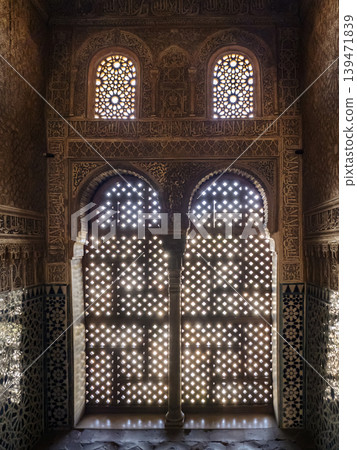 Ornate Moorish Stone Lattice Windows and Carved Islamic Arch Interior With Geometric Motifs, Alhambra, Granada Ornate Moorish Stone Lattice Windows and Carved Islamic Arch Interior With Geometric Motifs, Alhambra, Granada 139471839