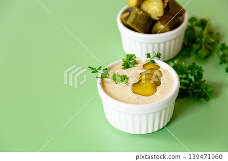 homemade tartar sauce with pickles and parsley in white bowl homemade tartar sauce with pickles and parsley in white bowl 139471960