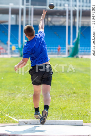 Young athlete shot put Young athlete shot put 139472002