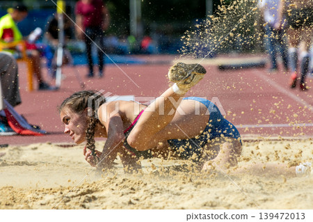 Sand spray landing in long jump Sand spray landing in long jump 139472013