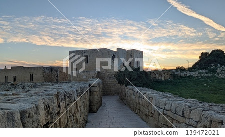 Evening view of sky with clouds behind of ruins on the hill  139472021