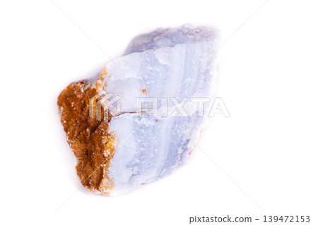 Macro mineral blue agate in the rock on white background Macro mineral blue agate in the rock on white background 139472153