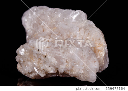 Macro mineral stone Amphibolite in quartz on black background Macro mineral stone Amphibolite in quartz on black background 139472164