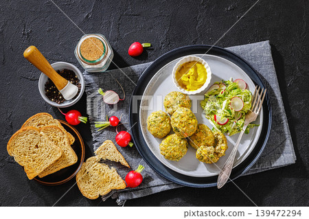 baked meat and vegetable polpette on a plate baked meat and vegetable polpette on a plate 139472294