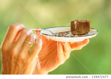 Delicious chocolate dessert enjoyed outdoors 139472477